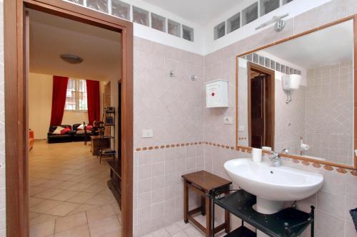 a bathroom with a sink and a mirror at Lucky Holidays in Rome