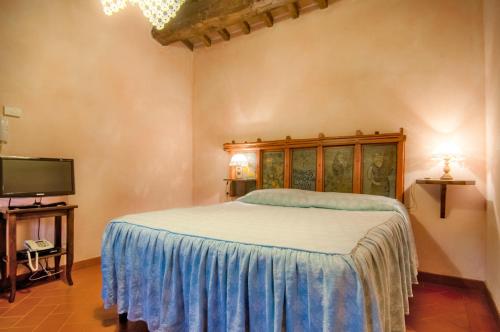 Ένα ή περισσότερα κρεβάτια σε δωμάτιο στο Agriturismo I Frati
