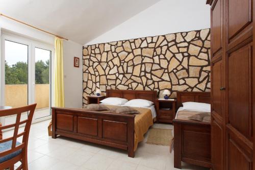 En eller flere senge i et værelse på Villa Ivas