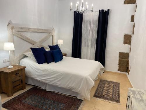 Postel nebo postele na pokoji v ubytování Casa Camelio