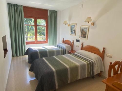 Postel nebo postele na pokoji v ubytování Hotel Puitavaca