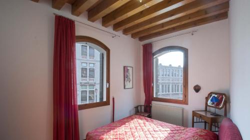 En eller flere senge i et værelse på Casa di Silvia & Daniele