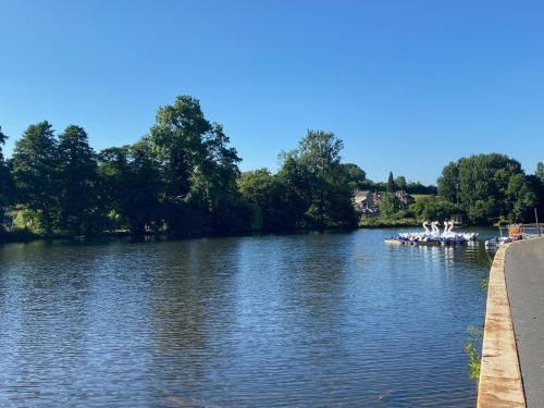 a river with boats in the middle of it at Fabulous 2 bed Historic Ground floor apartment Belper with free car parking next to property in Belper