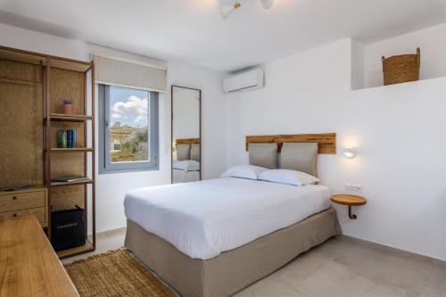 Posteľ alebo postele v izbe v ubytovaní Landi House Mykonos