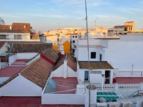 a view of roofs of buildings in a city at Royal Suites Estepona by Croma in Estepona