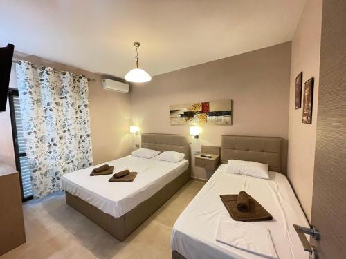 Postel nebo postele na pokoji v ubytování SEA VIEW APARTMENTS Aphrodite