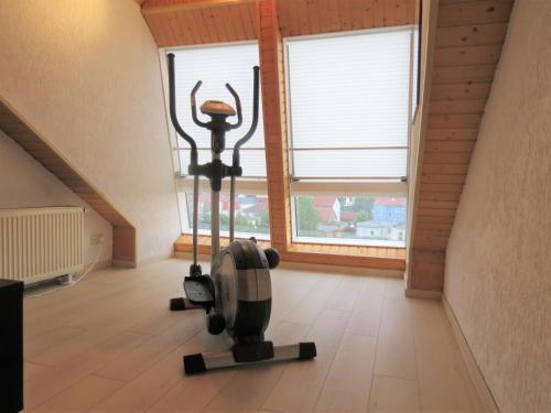 Penthouse Wolkenstein großzügige Maisonette auf 155 qm mit Whirlpool, Klima & Kaminにあるフィットネスセンターまたはフィットネス設備