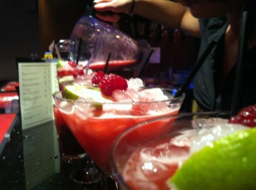 a row of drinks on a table with fruit at The Fairburn Hotel in Mauchline