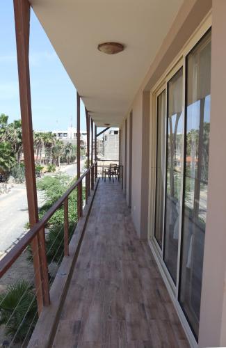 a corridor of a building with a balcony at KatlantiK Ca Madeira Deluxe in Sal Rei