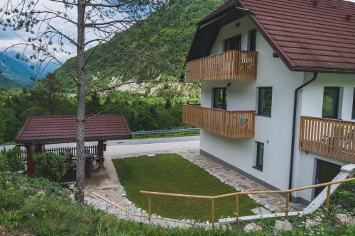 an external view of a house with a garden at Hiša Lojz in Žaga