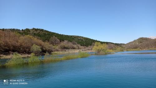 a view of a river with mountains in the background at Holiday home Marija in Vrlika