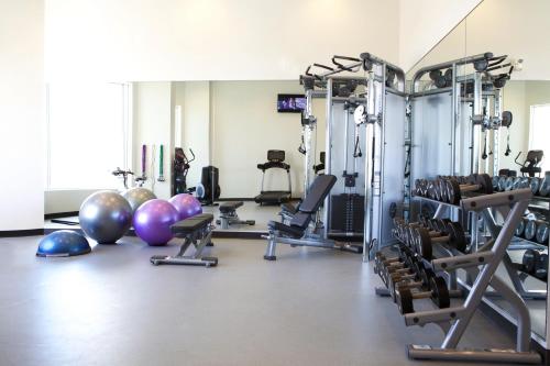 a gym with several exercise bikes and exercise balls at Grey Eagle Resort in Calgary