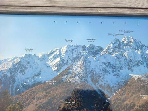 a picture of a mountain range with snow at Schlosswirt Chalets & Apartments in Großkirchheim