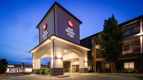 a building with a sign on the side of it at Best Western Plus Country Inn & Suites in Dodge City