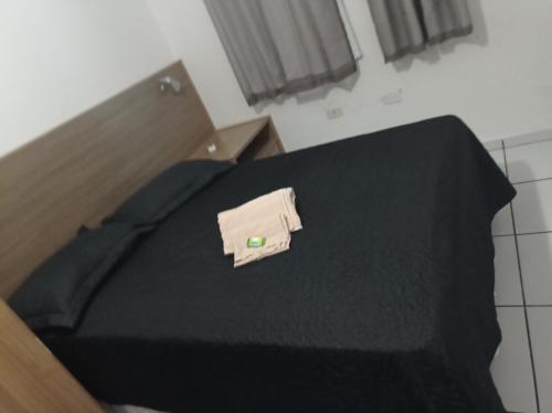 Campos Rede Apto Xにあるベッド