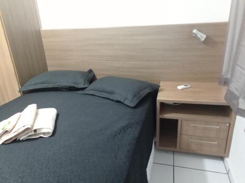 Campos Rede Apto Xにあるベッド