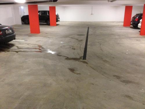 a parking garage with a lot of water on the floor at Hotel Schützenhaus in Uznach