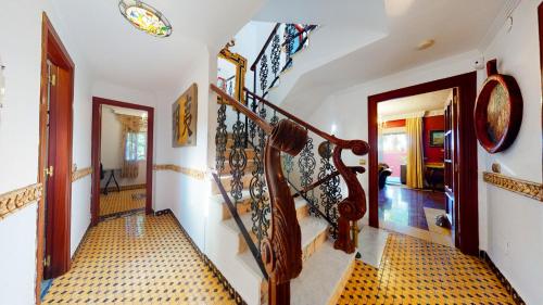 a staircase in a home with a spiral stair case at Majestic Villa by the Beach Heated Private Pool & Jacuzzi in Benalmádena