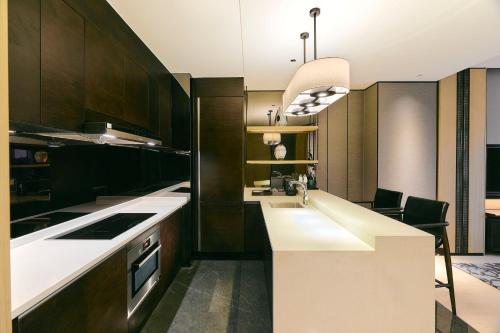 a kitchen with a sink and a counter top at Kempinski Residences Guangzhou - Free shuttle between hotel and Exhibition Center during Canton Fair & Exhibitor registration Counter in Guangzhou