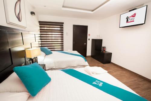 Cama o camas de una habitación en Hotel El Faro