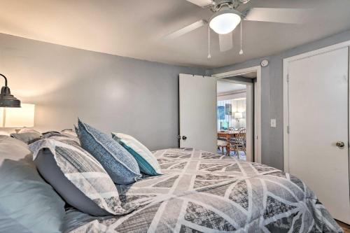 a bedroom with a bed with pillows and a ceiling fan at Idyllic Waterfront Escape with Private Boat Dock! in Santee