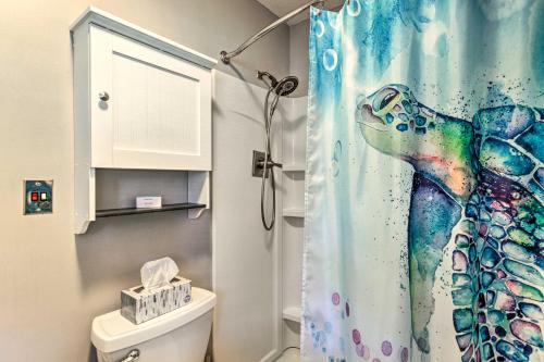 a bathroom with a shower curtain with a dolphin at Modern Studio with Balcony about 1 Mi to Lake Lure! in Lake Lure