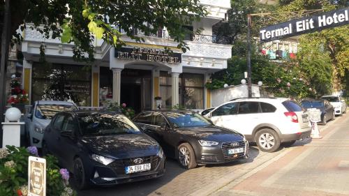 a group of cars parked in front of a building at Termal Elit Hotel in Gokcedere