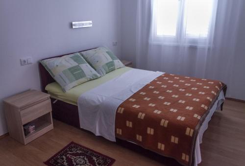 Postel nebo postele na pokoji v ubytování Apartmani Pucarin
