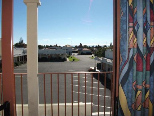 a balcony with a view of a parking lot at Valdez Motor Lodge in Hastings