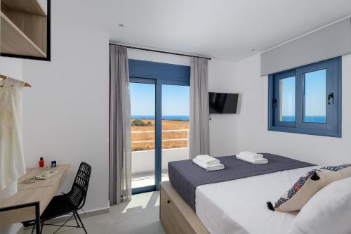 A bed or beds in a room at Astrea Villas