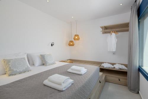 A bed or beds in a room at Astrea Villas