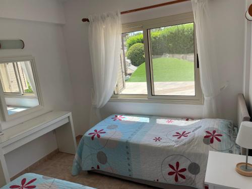 Cama ou camas em um quarto em Ilios Akti