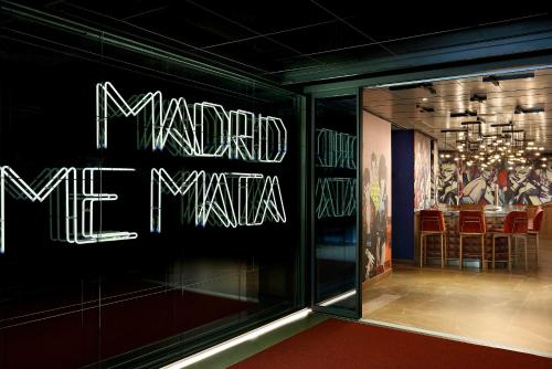 a store window with a sign that reads madrid mexia at Hard Rock Hotel Madrid in Madrid