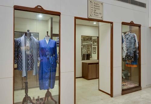 a display case in a store with a blue dress at Shahpura Residency in Jaipur