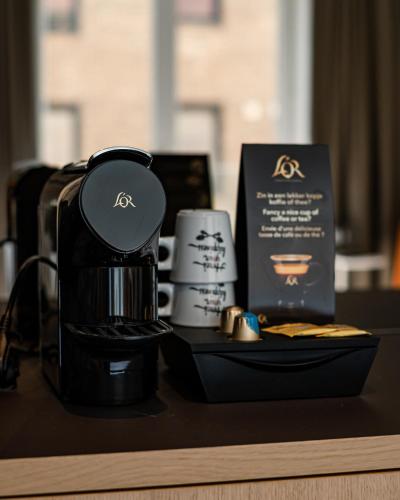 Set per la preparazione di tè e caffè presso Hotel Le Bois De Bruges