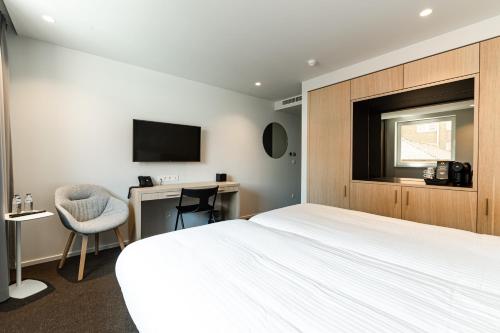 TV o dispositivi per l'intrattenimento presso Hotel Le Bois De Bruges