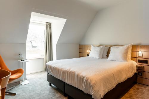 Letto o letti in una camera di Hotel Le Bois De Bruges