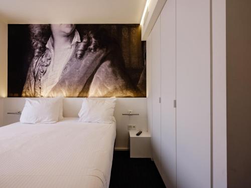 Letto o letti in una camera di Hotel Le Bois De Bruges