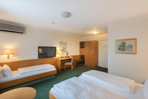 Llit o llits en una habitació de Hotel Belmont Classic