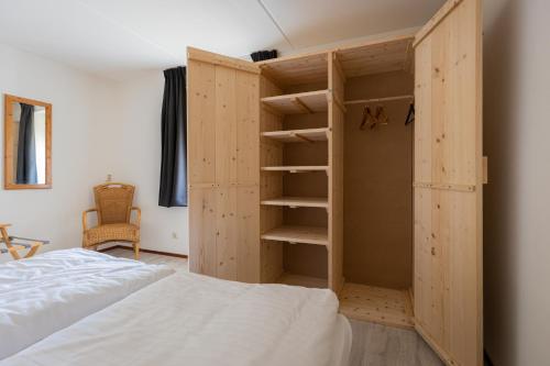 מיטה או מיטות בחדר ב-Escape, appartement met groot terras