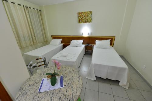 Ένα ή περισσότερα κρεβάτια σε δωμάτιο στο Vind's Plaza Hotel