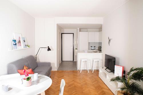 a living room with a couch and a table at Marconi 442 in Sanremo