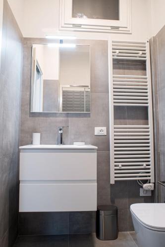 a bathroom with a sink and a mirror at Marconi 442 in Sanremo