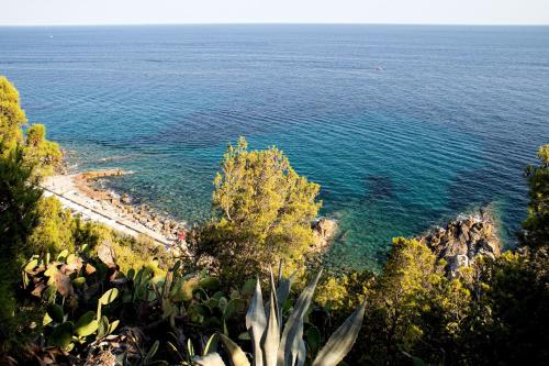 a view of a beach with people in the water at Marconi 442 in Sanremo