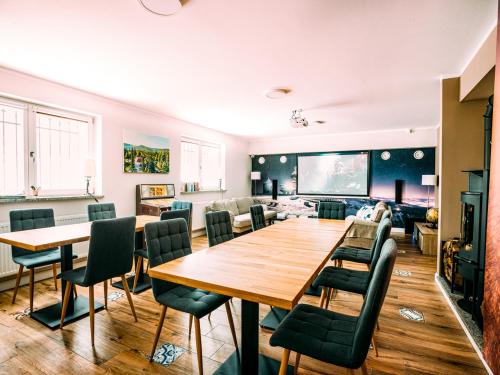 a living room with a large table and chairs at Stacja Szklarska Poręba - cisza i komfort in Szklarska Poręba