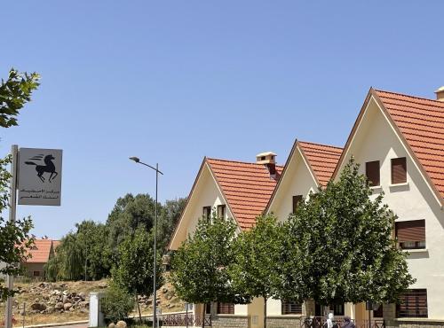 a row of houses with red roofs at Ifrane Chalet in Ifrane