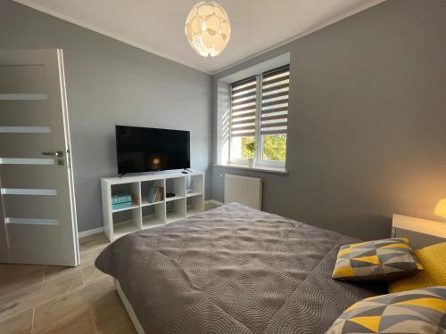 Posteľ alebo postele v izbe v ubytovaní Apartament HAMBURG
