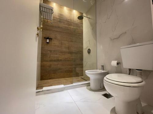 a bathroom with a shower and a toilet in it at Up Tribeca in Buenos Aires