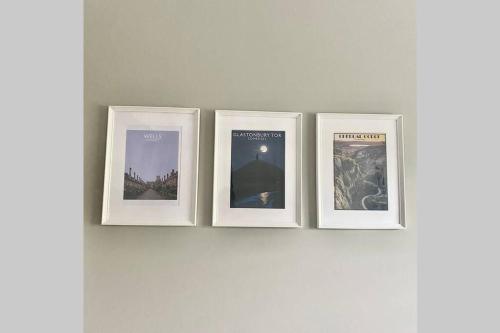 four framed photographs are on a wall at Self contained annexe in the heart of Wedmore in Wedmore