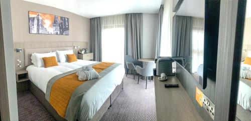 Ένα ή περισσότερα κρεβάτια σε δωμάτιο στο Maldron Hotel Glasgow City